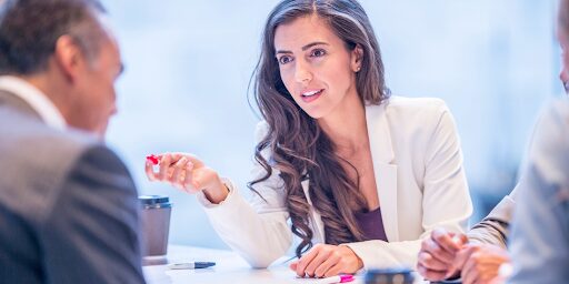 Female investigator consulting with clients about case strategy and investigative services – Forefront Investigations